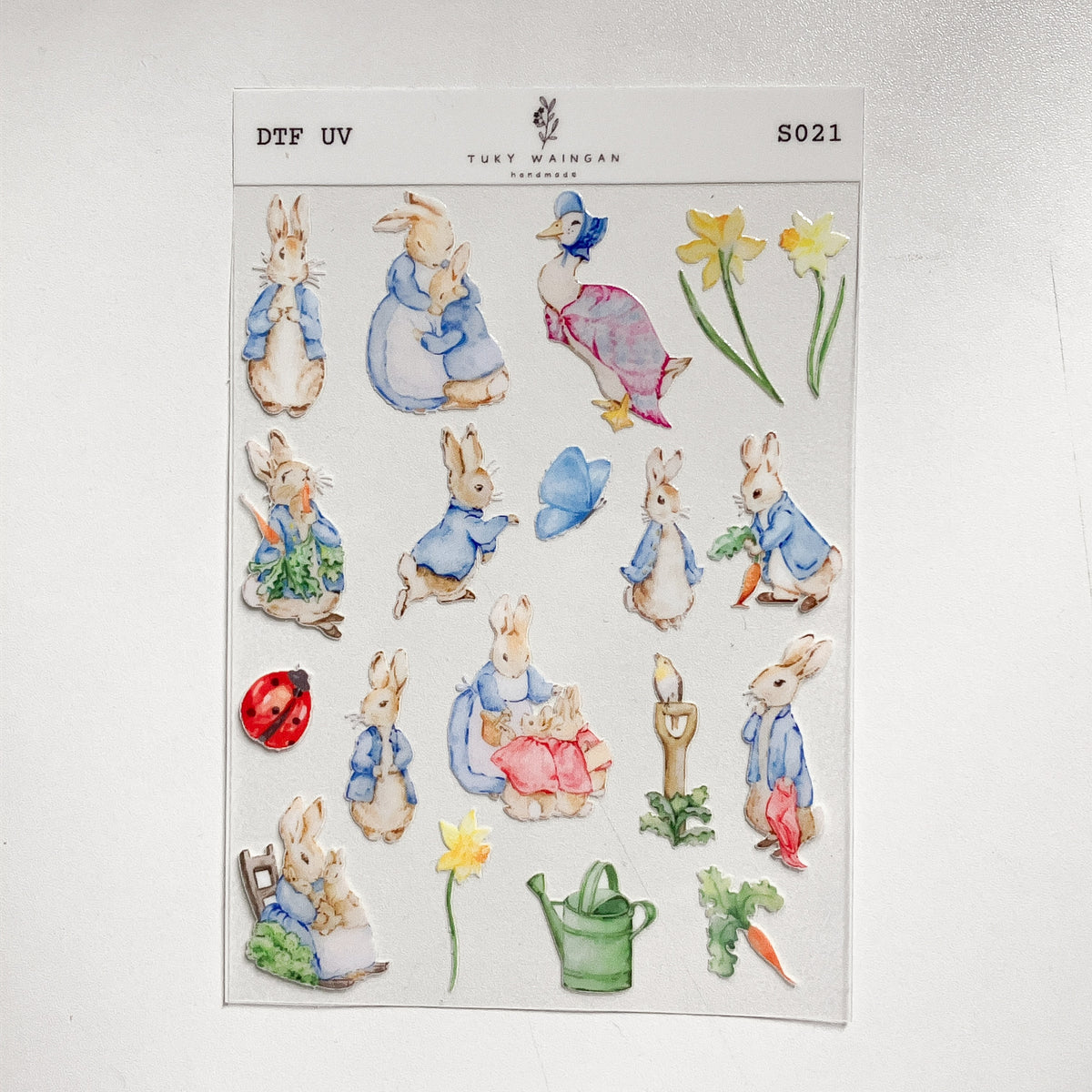 Plancha de stickers DTF UV · Conejitos de jardín · S021