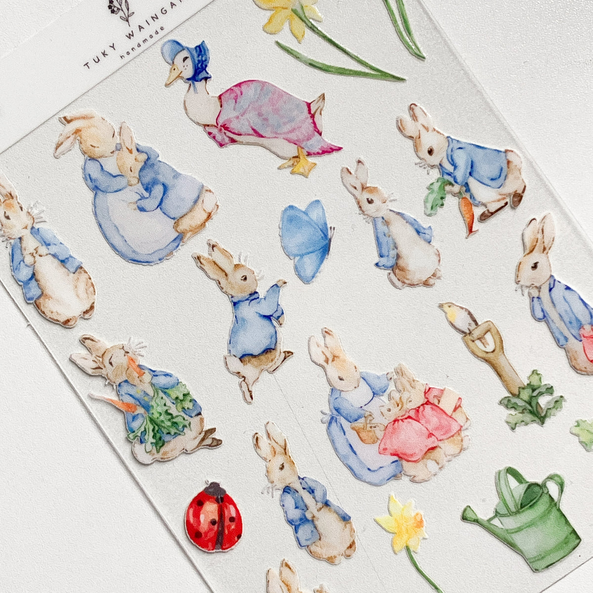 Plancha de stickers DTF UV · Conejitos de jardín · S021